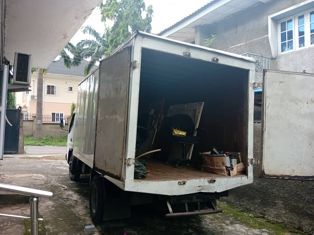 Open rear cargo area of a Korlun mini box truck being loaded