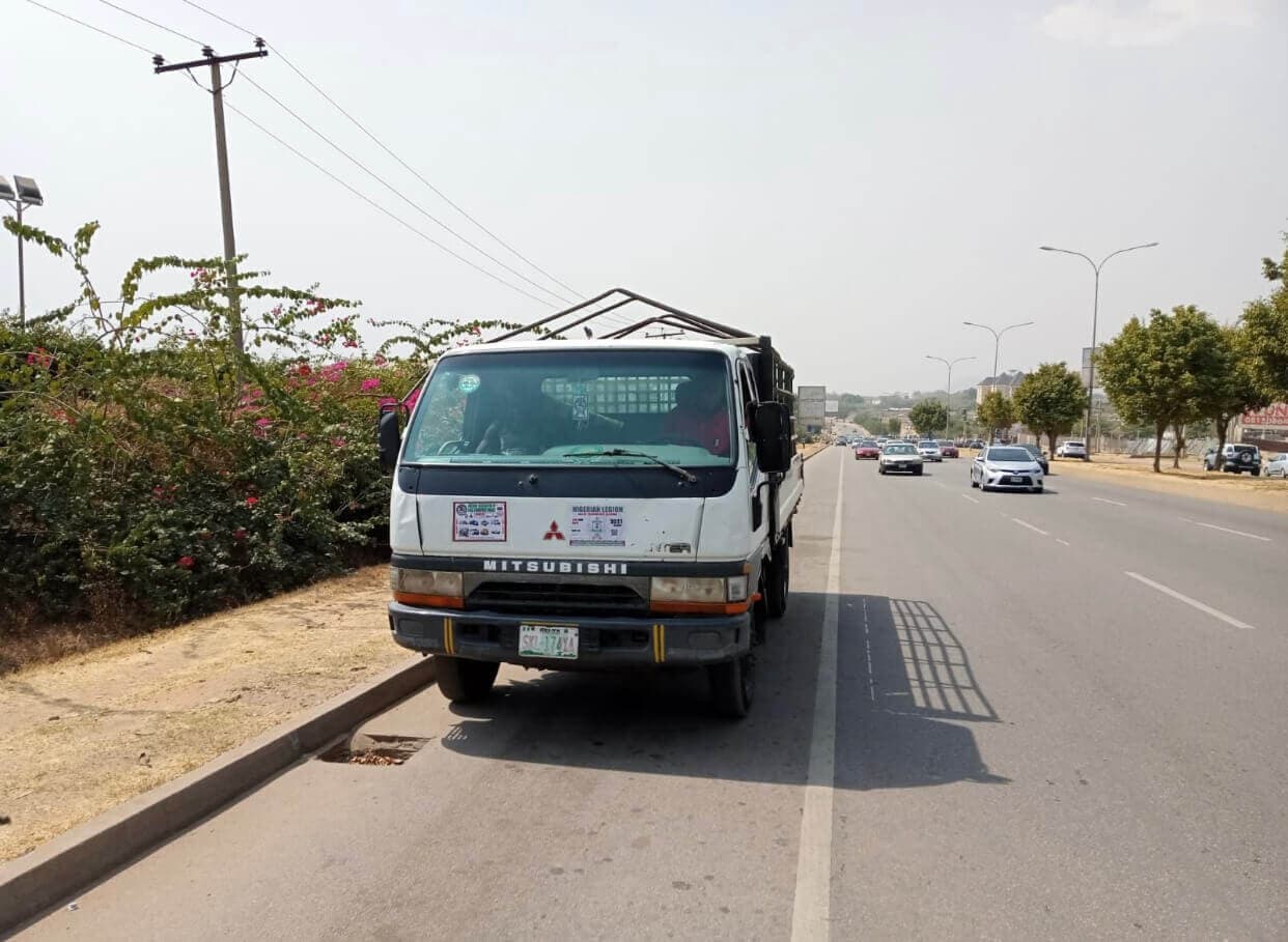Korlun Canter flatbed truck on an Abuja road